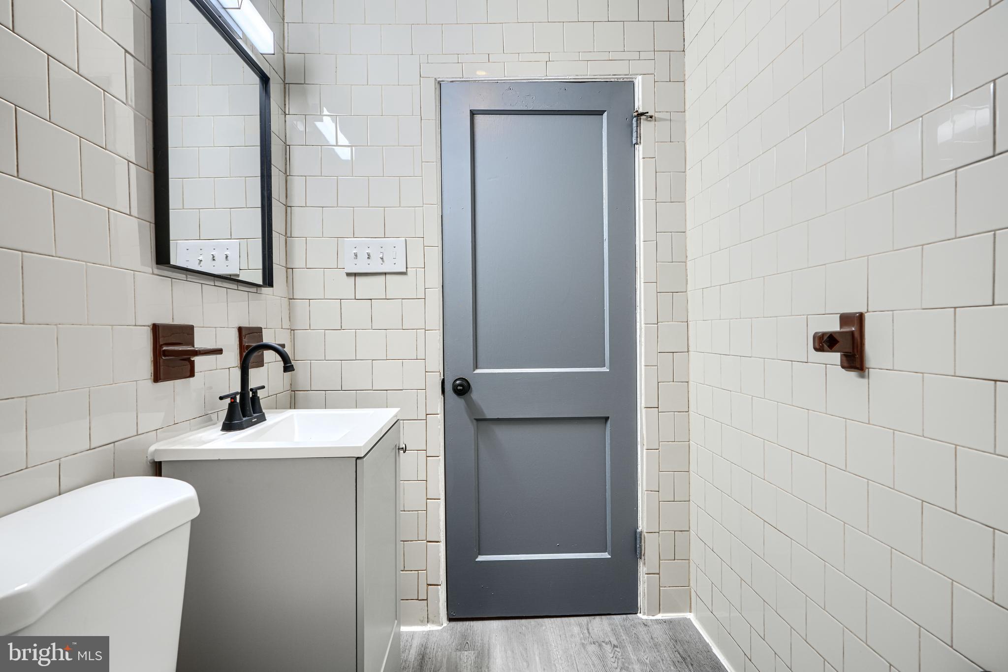 2123 Graythorn Road Middle River, MD 21220 - Photo 17 of 29 a bathroom with a sink a toilet and shower