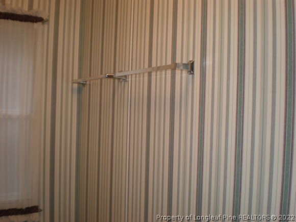 848 Torchwood Road Carthage, NC 28327 - Photo 11 of 14 a view of a curtain with a wooden door