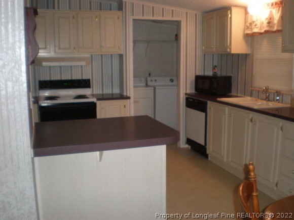 848 Torchwood Road Carthage, NC 28327 - Photo 12 of 14 a kitchen with cabinets and a stove