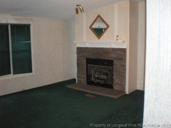 848 Torchwood Road Carthage, NC 28327 - Photo 14 of 14 a living room with a fireplace