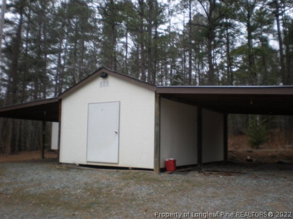 848 Torchwood Road Carthage, NC 28327 - Photo 4 of 14 a view of backyard with small cabin