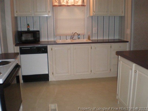 848 Torchwood Road Carthage, NC 28327 - Photo 5 of 14 a view of cabinets and microwave