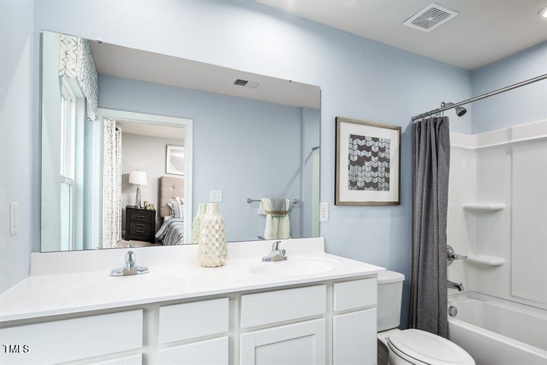 237 Suburban Meadow Pass Wendell, NC 27591 - Photo 13 of 15 a bathroom with a sink toilet and shower