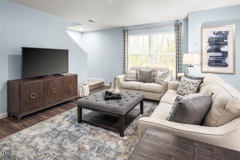 237 Suburban Meadow Pass Wendell, NC 27591 - Photo 3 of 15 a living room with furniture and a flat screen tv