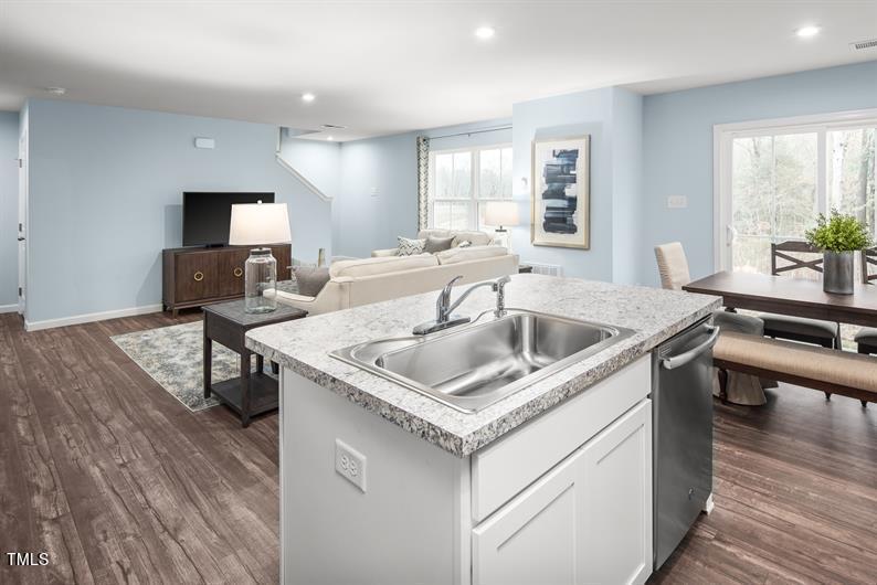 237 Suburban Meadow Pass Wendell, NC 27591 - Photo 7 of 15 a kitchen with a sink a counter space and appliances