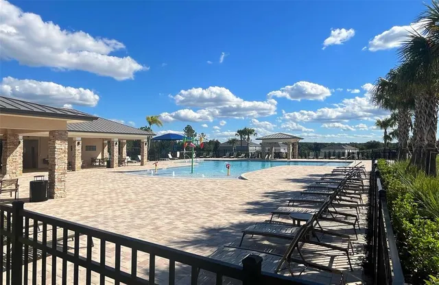 a view of a house with swimming pool
