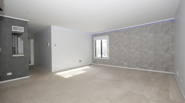 a view of empty room with windows