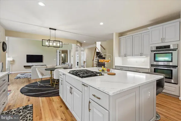 a kitchen with a stove and a sink