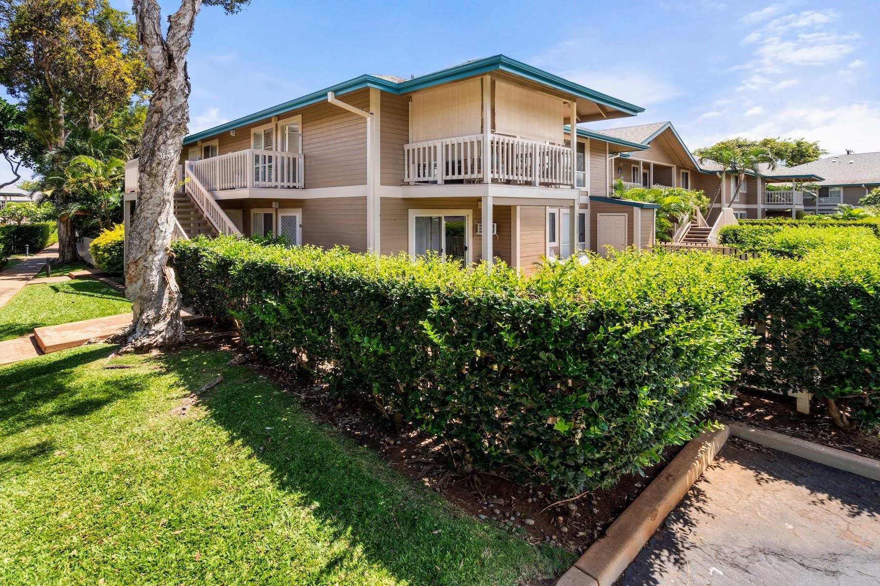 480 Kenolio Road, Unit 12201 Kihei, HI 96753 - Photo 18 of 25 a front view of a house with a yard