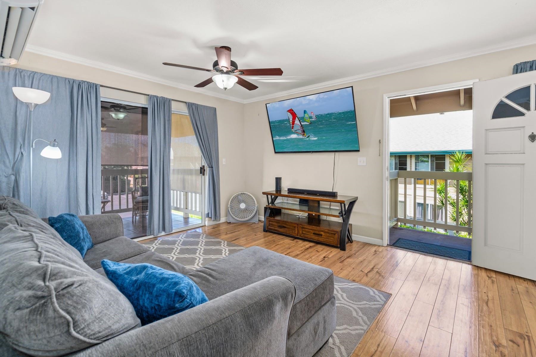 480 Kenolio Road, Unit 12201 Kihei, HI 96753 - Photo 2 of 25 a living room with furniture and a wooden floor