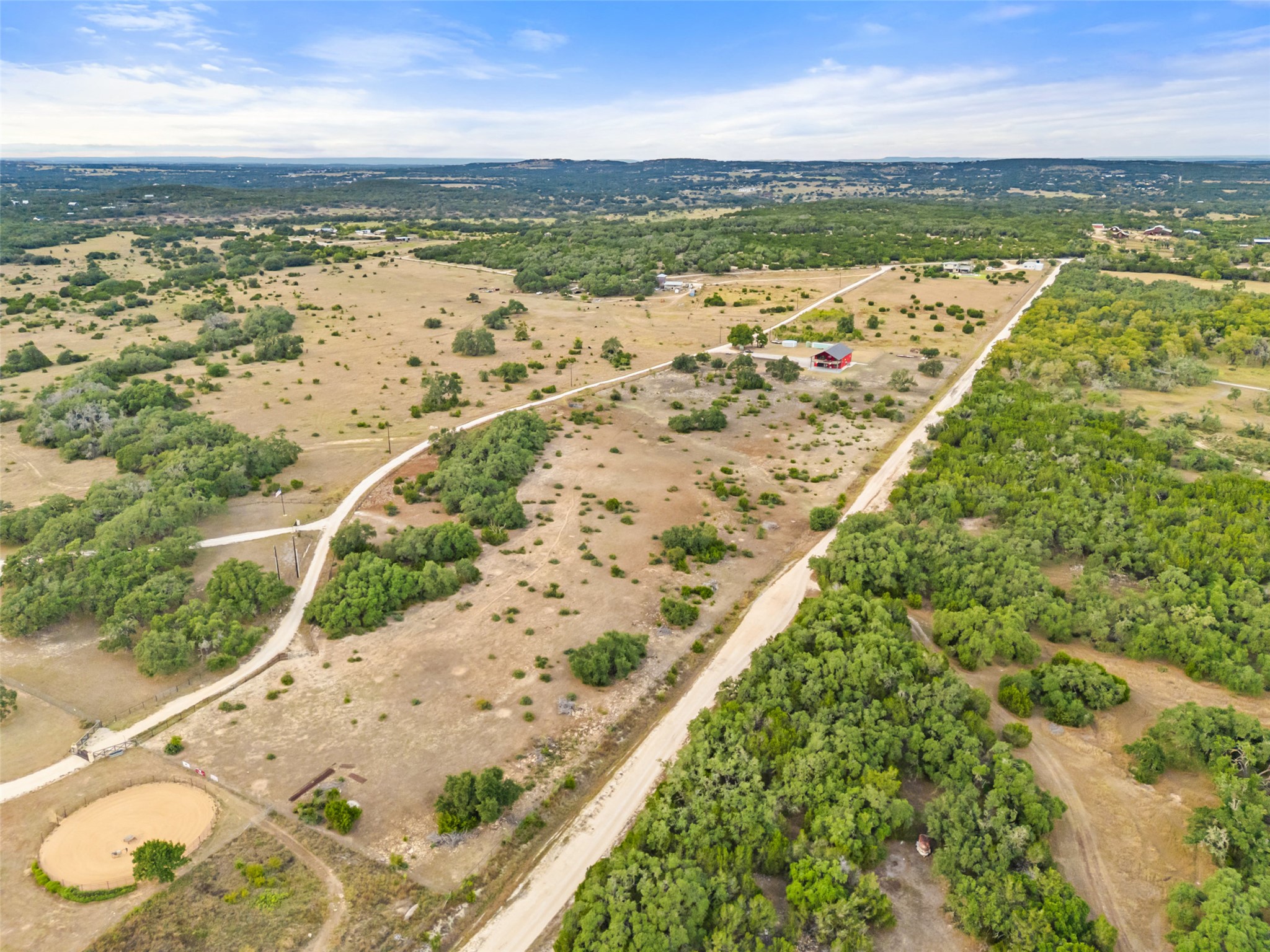 561 Broken Bit Trail Dripping Springs, TX 78620 - Photo 37 of 40 Aerial view of property and surrounding area featuring rural landscape