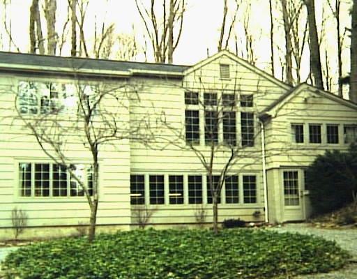 13 Catamount Road Westport, CT 06880 - Photo 1 of 1 a view of a large brick building next to a yard