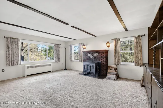 a dining room with furniture and window