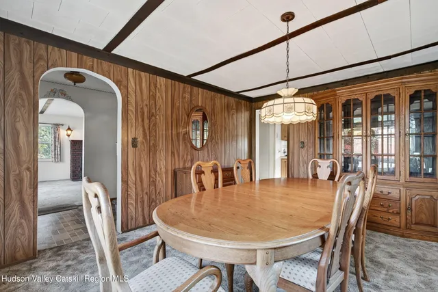 a view of a livingroom with a ceiling fan and window
