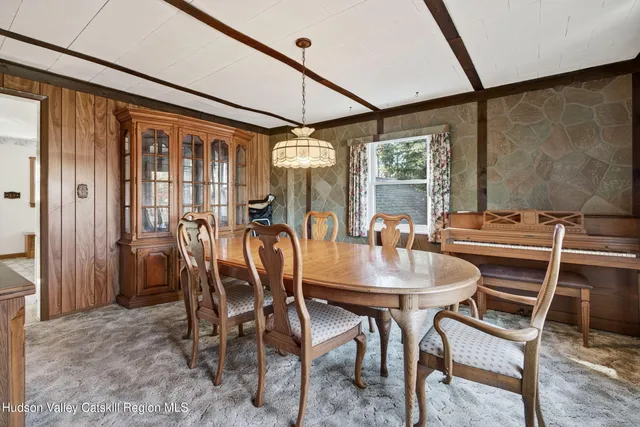 an empty room with windows and cabinet