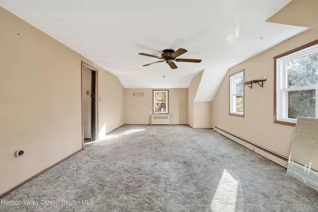 a view of a room with wooden walls