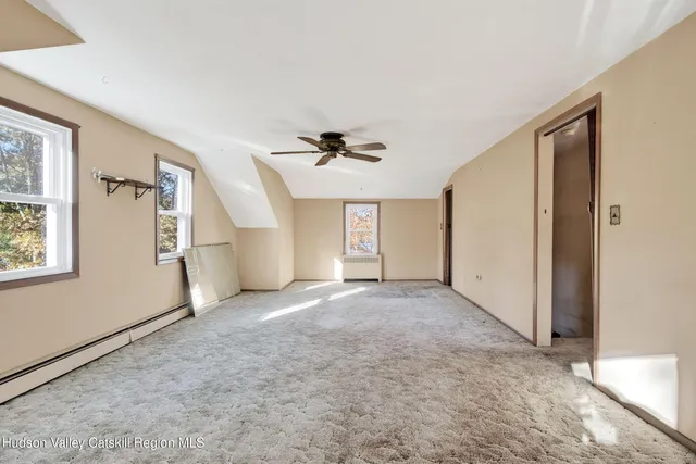 a view of a room with wooden walls