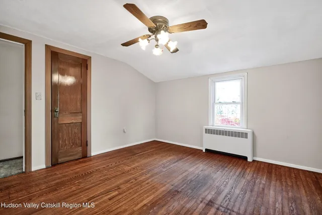 a backyard of a house with yard and outdoor seating