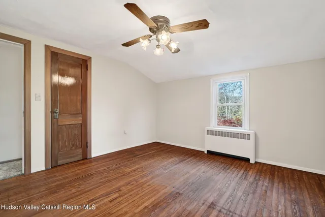 a view of a park with iron fence