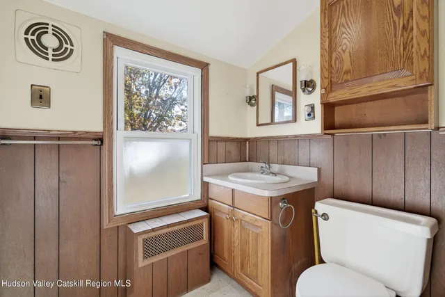 a backyard of a house with lots of green space and fountain