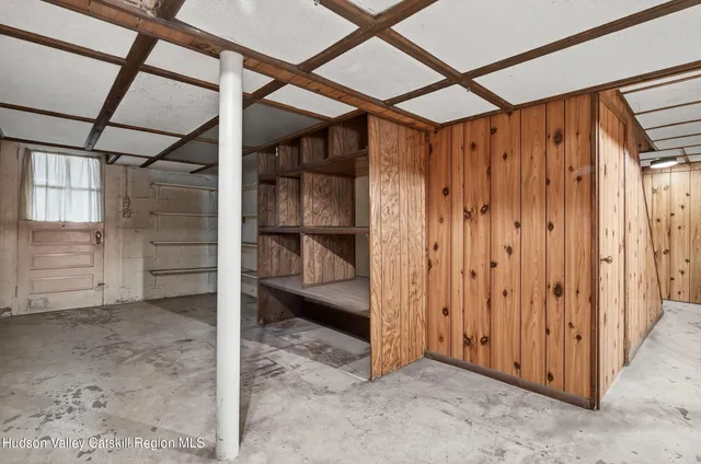 a view of a yard with basketball court