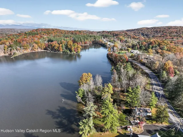 a kitchen with a refrigerator a stove top oven and cabinets