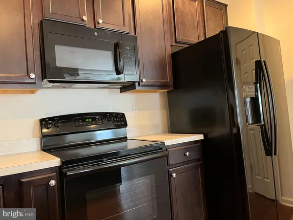 a close view of a stove and microwave
