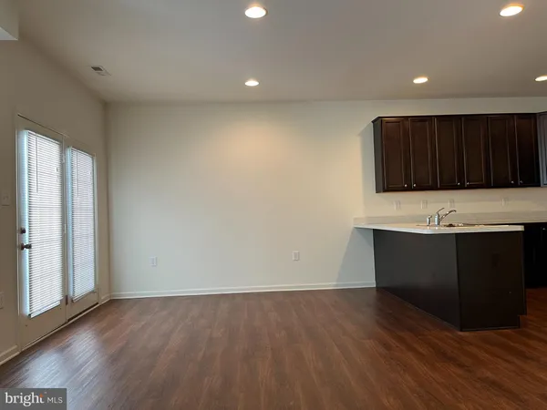 a kitchen with wooden cabinets and a sink