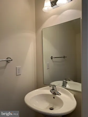 a bathroom with a sink and mirror