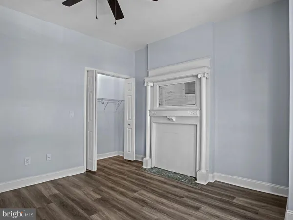 a view of a porch with wooden floor and furniture