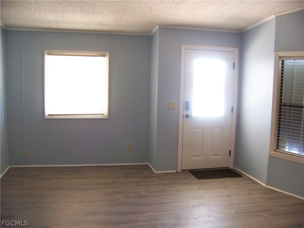 15550 Burnt Store Road, Unit 101 Punta Gorda, FL 33955 - Photo 12 of 50 an empty room with window