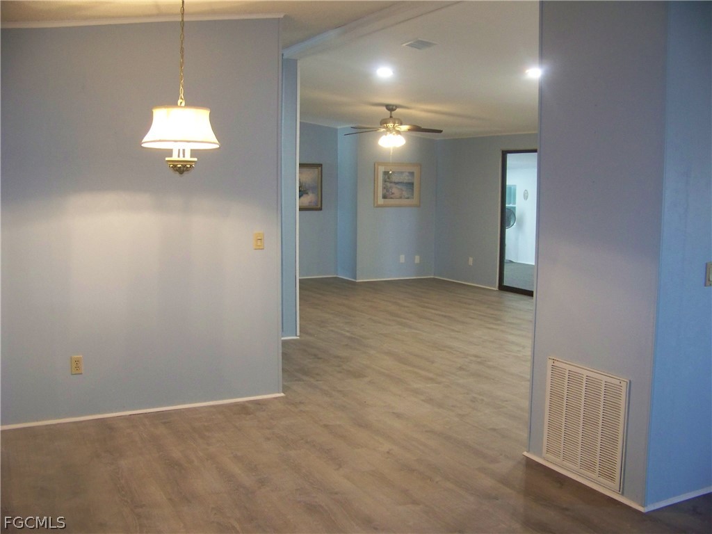 15550 Burnt Store Road, Unit 101 Punta Gorda, FL 33955 - Photo 18 of 50 a view of an empty room with a window