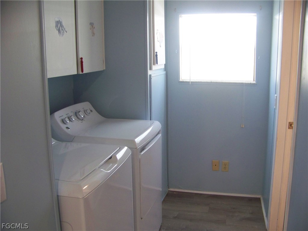 15550 Burnt Store Road, Unit 101 Punta Gorda, FL 33955 - Photo 20 of 50 a utility room with washer and dryer