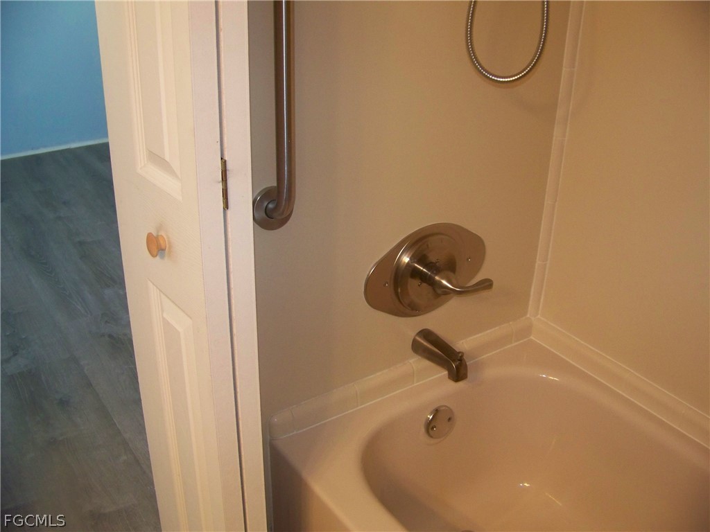 15550 Burnt Store Road, Unit 101 Punta Gorda, FL 33955 - Photo 30 of 50 a bathroom with a shower