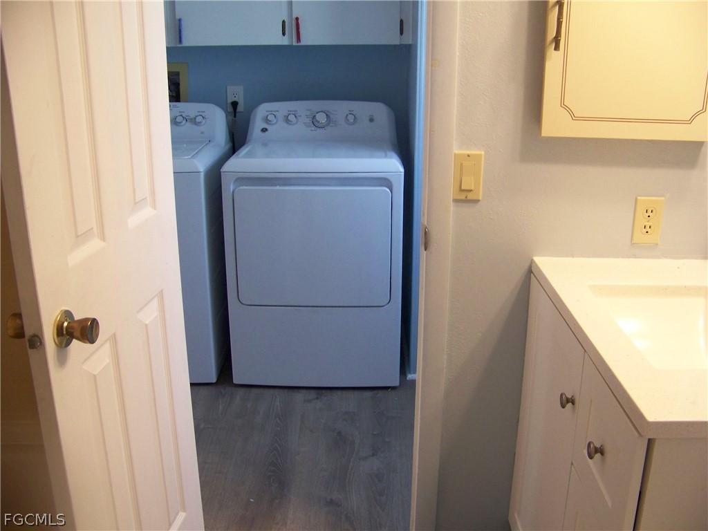 15550 Burnt Store Road, Unit 101 Punta Gorda, FL 33955 - Photo 32 of 50 a utility room with dryer and washer