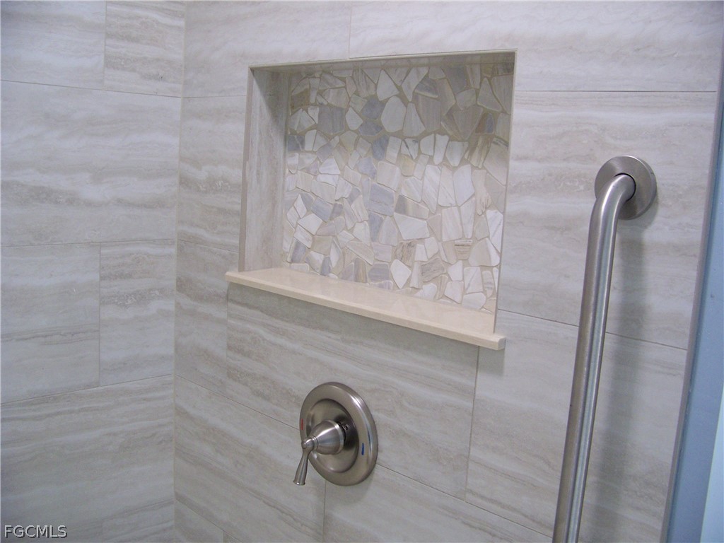 15550 Burnt Store Road, Unit 101 Punta Gorda, FL 33955 - Photo 38 of 50 a close view of a shower in bathroom