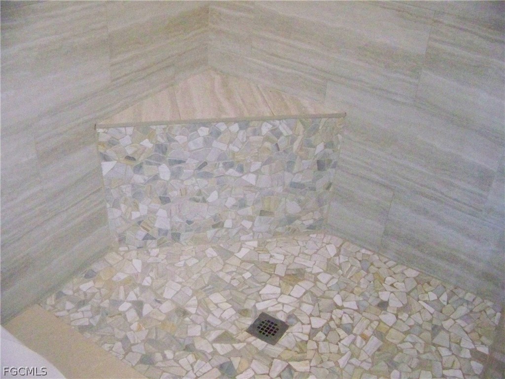 15550 Burnt Store Road, Unit 101 Punta Gorda, FL 33955 - Photo 39 of 50 a close up of a shower