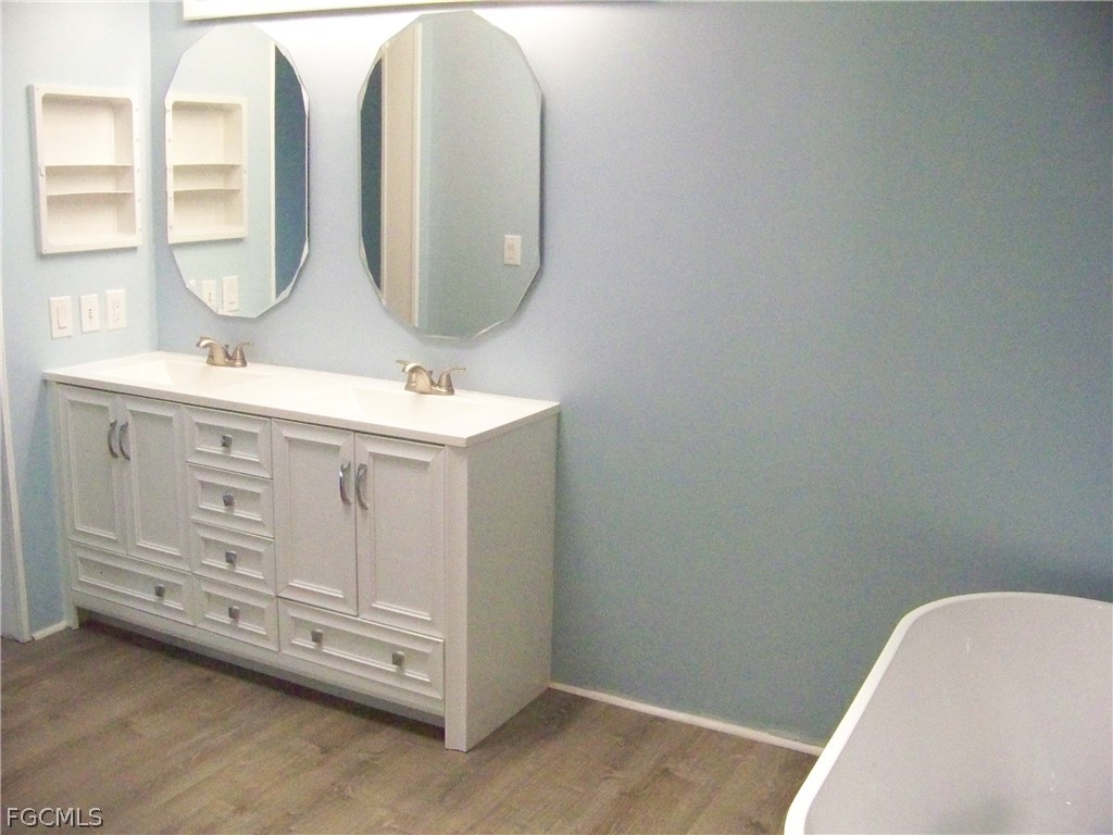 15550 Burnt Store Road, Unit 101 Punta Gorda, FL 33955 - Photo 40 of 50 a bathroom with a sink and a mirror