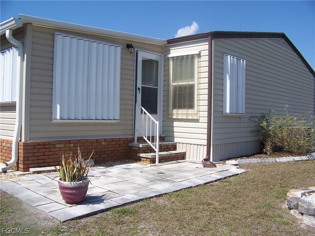 15550 Burnt Store Road, Unit 101 Punta Gorda, FL 33955 - Photo 4 of 50 a front view of a house with a patio