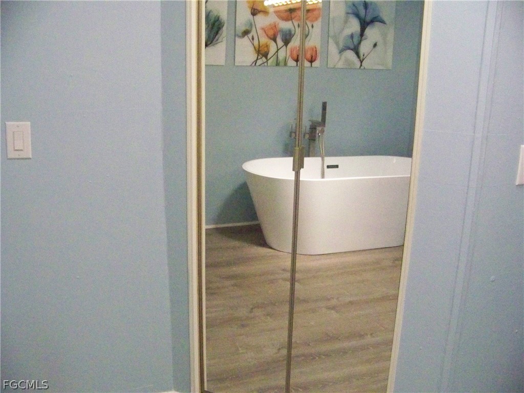 15550 Burnt Store Road, Unit 101 Punta Gorda, FL 33955 - Photo 41 of 50 a white bath tub sitting in a bathroom