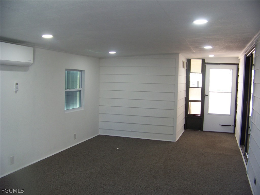 15550 Burnt Store Road, Unit 101 Punta Gorda, FL 33955 - Photo 44 of 50 an empty room with windows