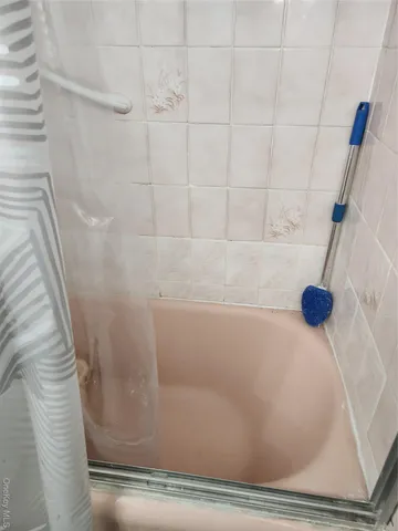a view of a bathtub in a bathroom