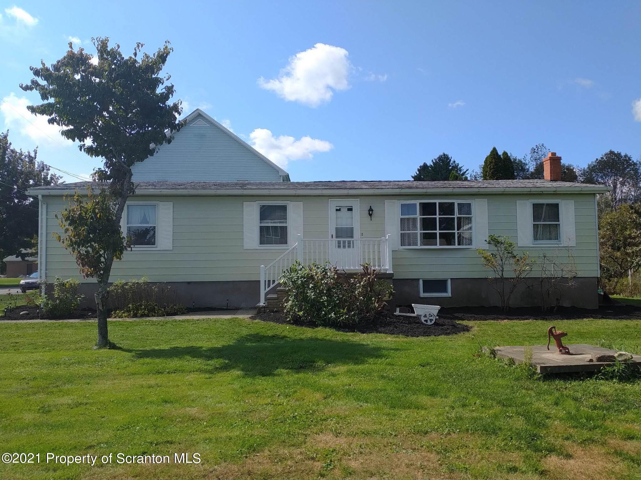 a house view with a garden space