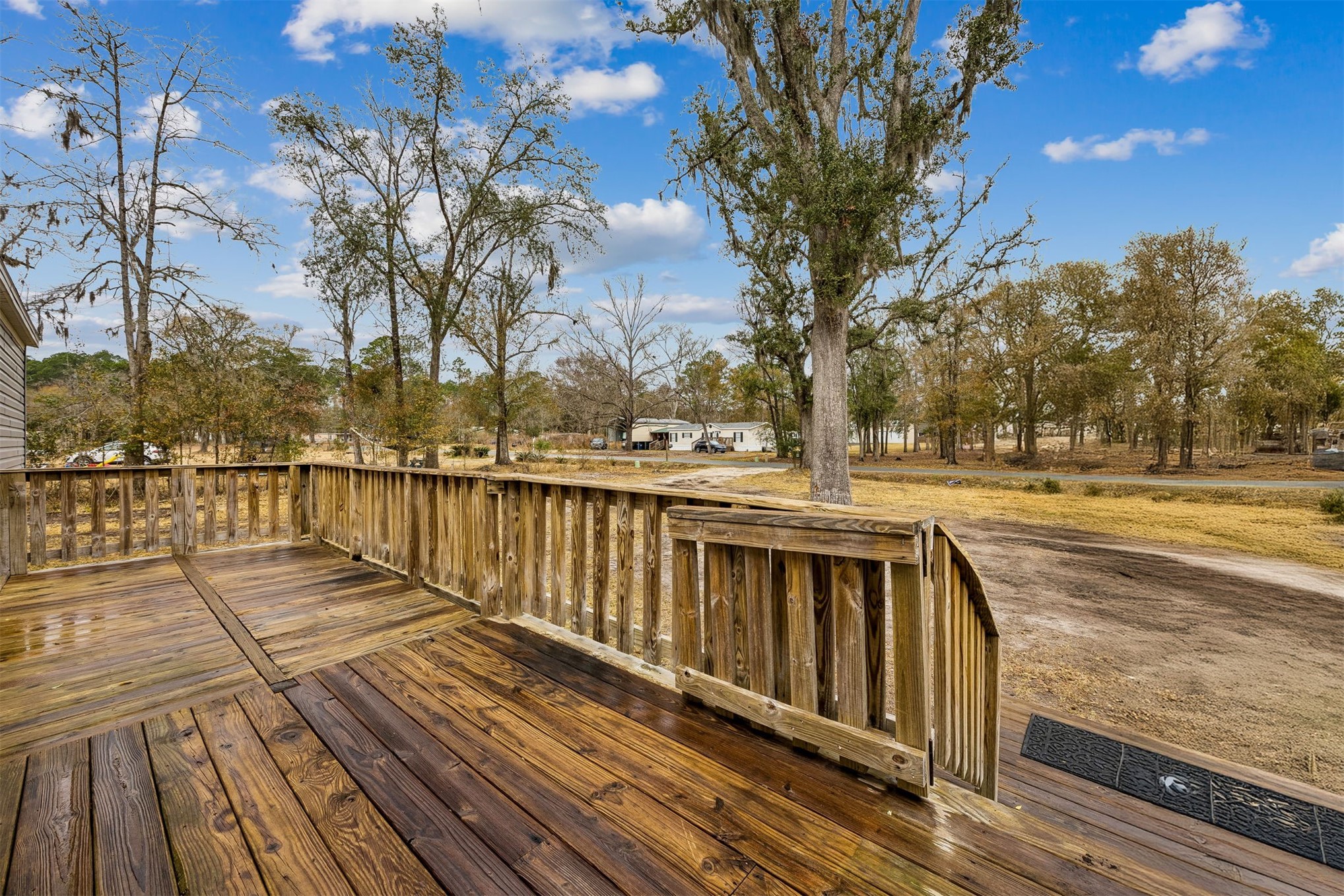54124 Catherine Avenue Callahan, FL 32011 - Photo 17 of 29 a view of wooden deck with a lake view