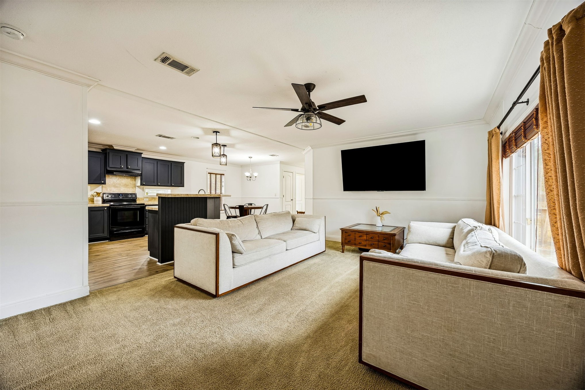 54124 Catherine Avenue Callahan, FL 32011 - Photo 19 of 29 a living room with furniture and a flat screen tv