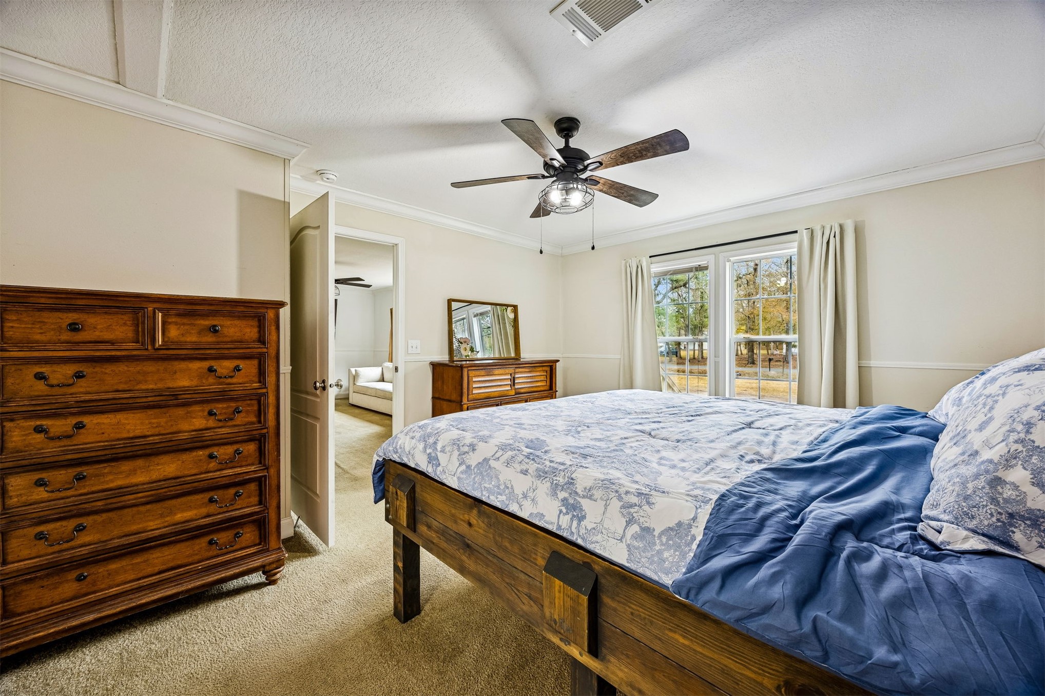 54124 Catherine Avenue Callahan, FL 32011 - Photo 25 of 29 a bedroom with a bed and a dresser