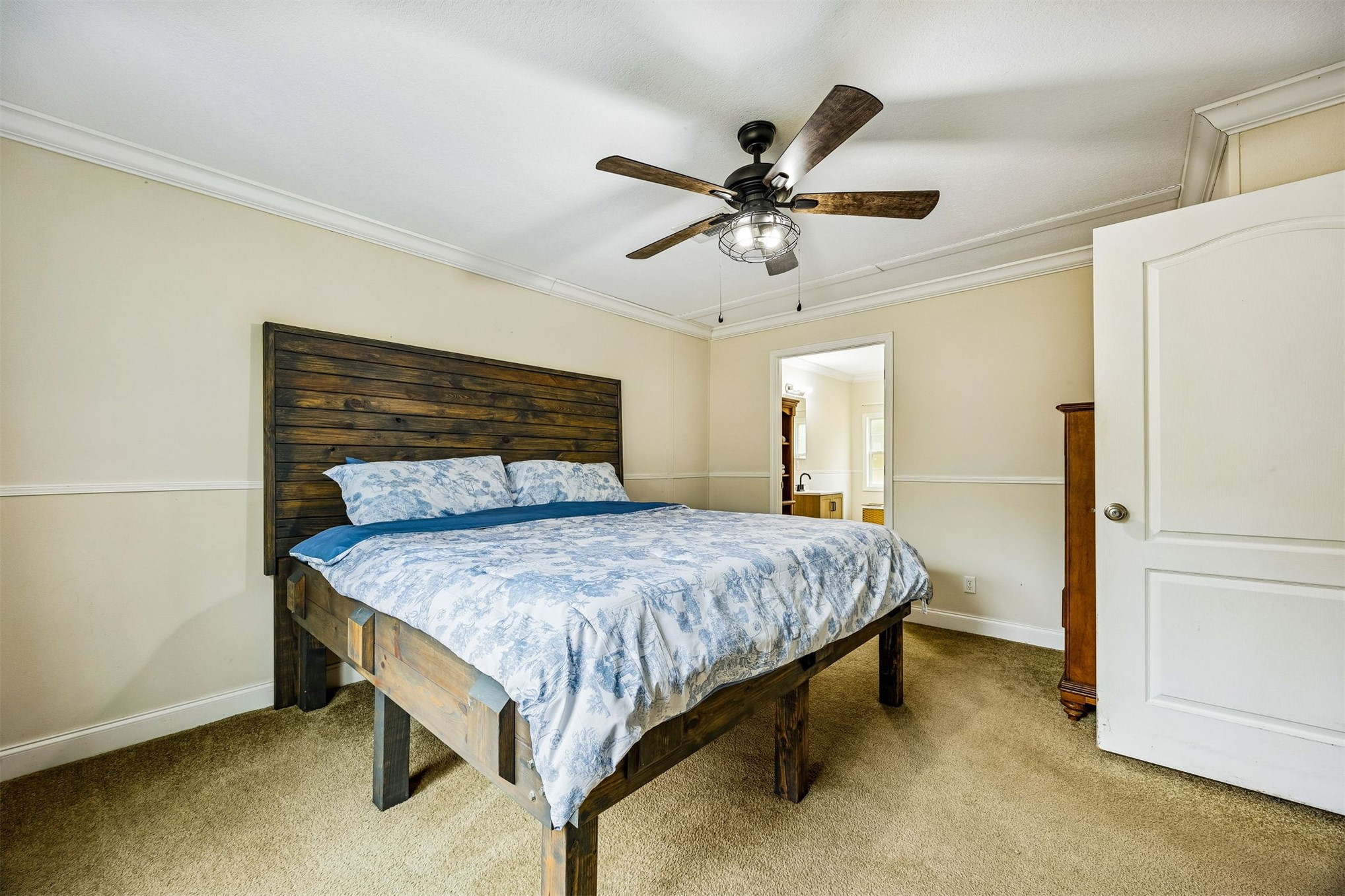 54124 Catherine Avenue Callahan, FL 32011 - Photo 5 of 29 a bedroom with a bed and a chandelier