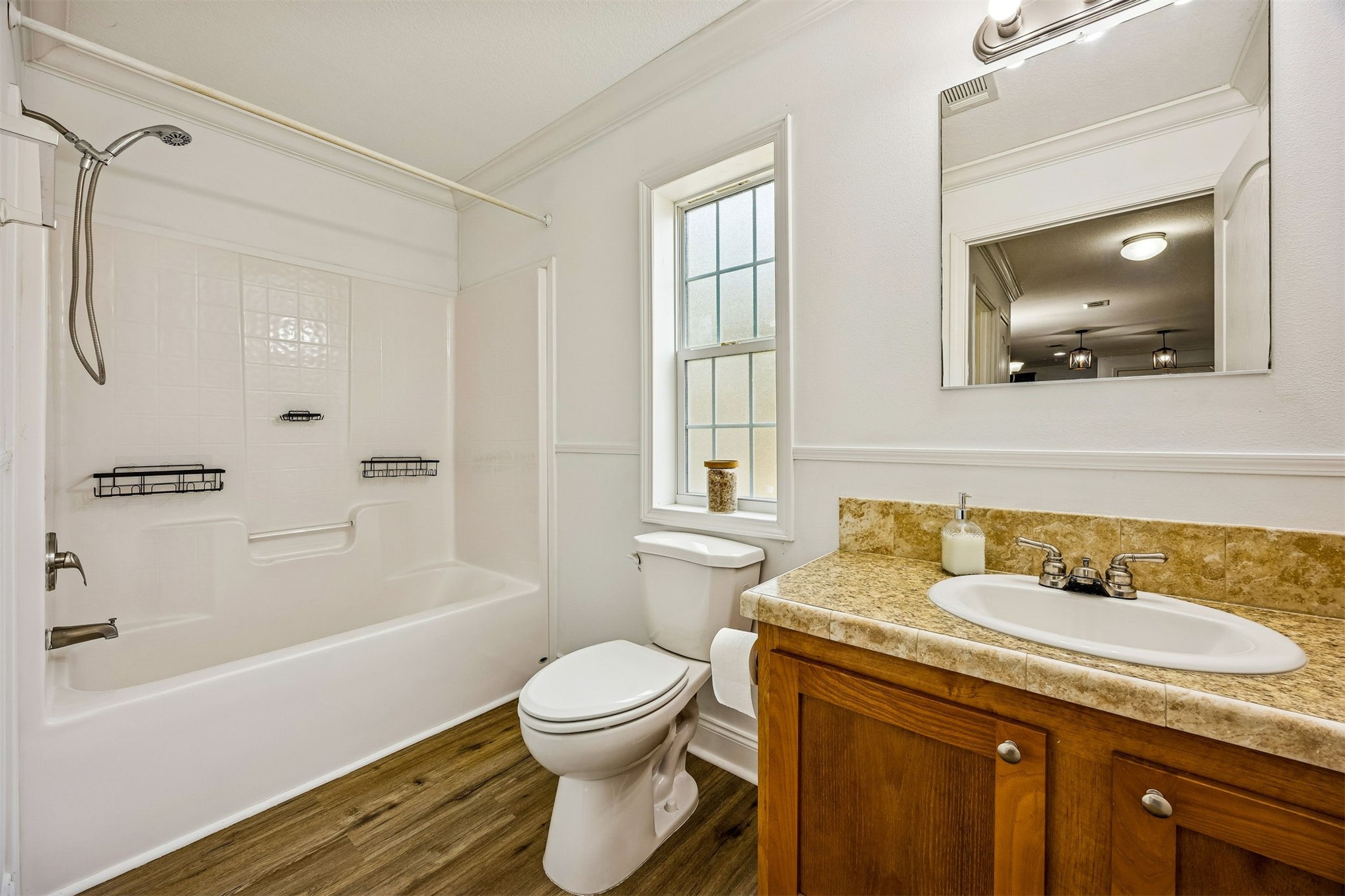 54124 Catherine Avenue Callahan, FL 32011 - Photo 8 of 29 a bathroom with a granite countertop sink toilet and shower