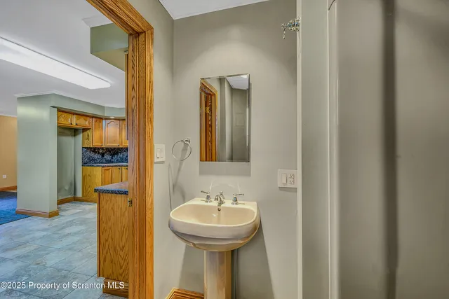 a bathroom with a sink and a mirror