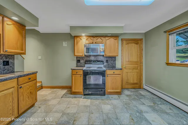 a kitchen with stainless steel appliances granite countertop a stove and a sink